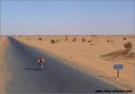 Lonely biker in the huge Sahara